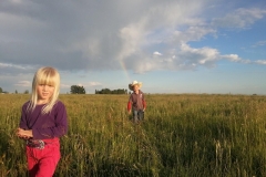 Setting fence as a family after a rain.
